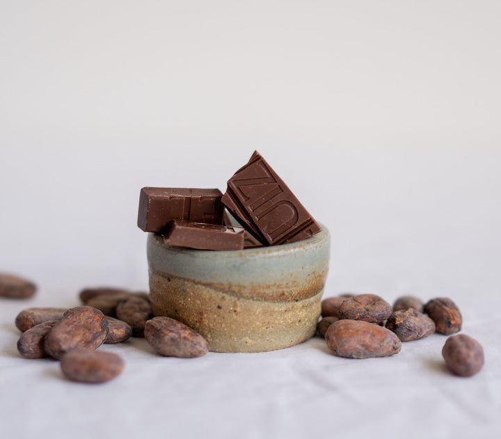 Discover what makes dark milk chocolate so special — more cacao, less sugar, and the flavour of the bean shining through.